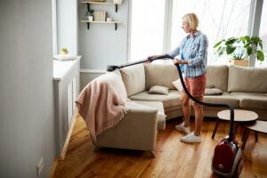Woman using a quality vacuum to keep her home clean