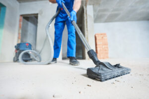 Man vacuuming for construction cleaning services